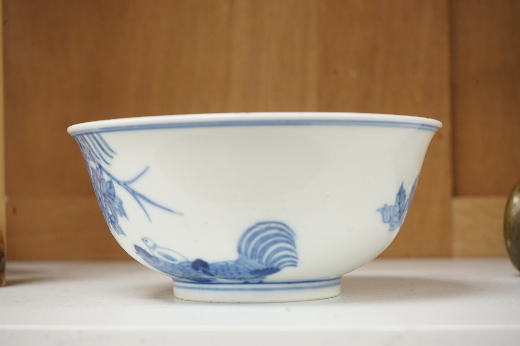 A Chinese blue and white bowl, decorated with flowers and birds, 14.5cm in diameter